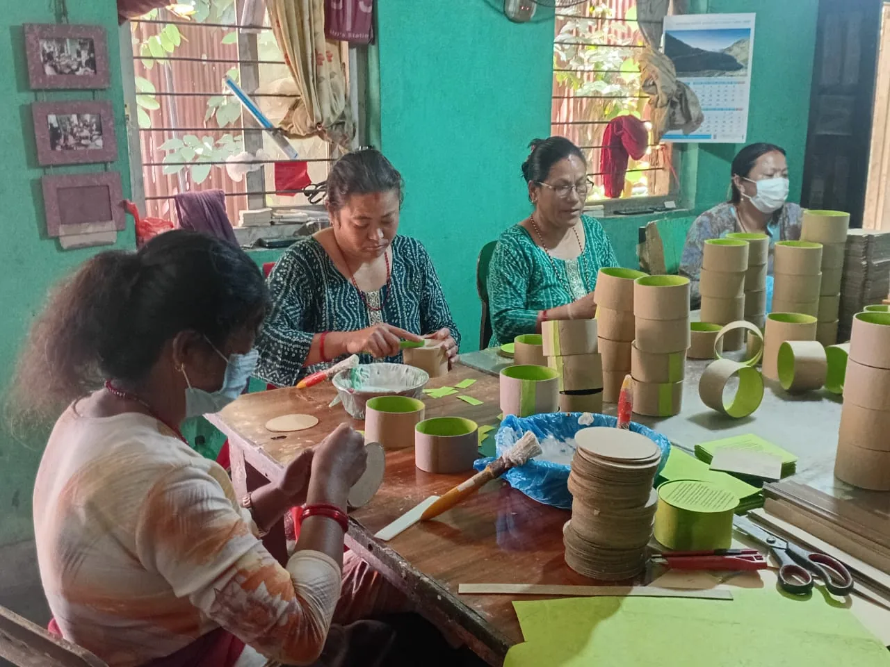 At the Bench — Gluing and lining rice-paper boxes in the Kathmandu workshop.